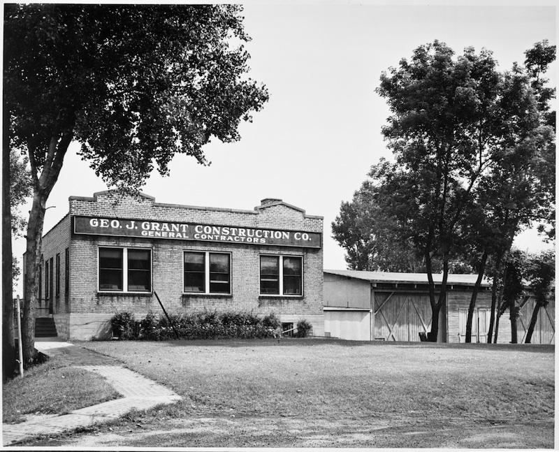 Black and white image of the brick building that was the George Grant construction company office